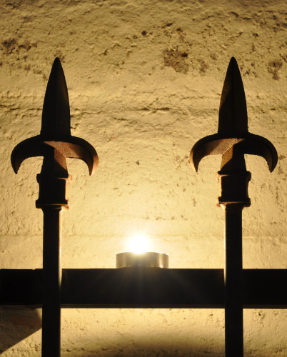 Iron Bars with Candle